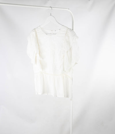 Blusa Blanca troquelada con manga abullonada