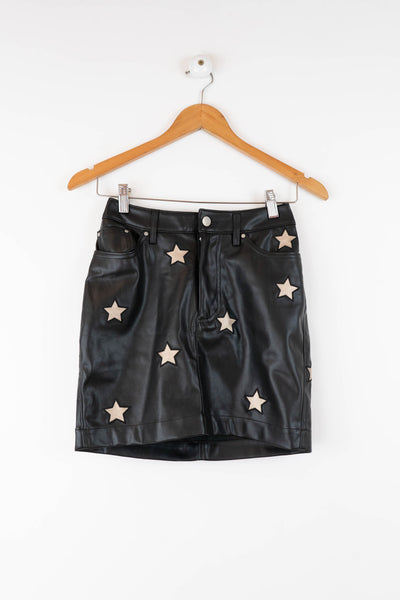 Falda de polipiel negra con estrellas
